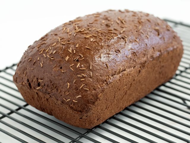 a loaf of bread sitting on top of a cooling rack