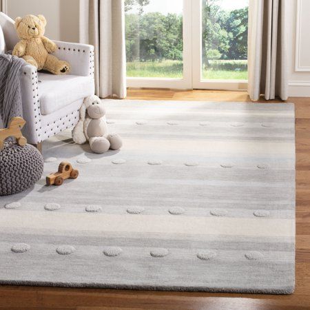 a child's room with teddy bears and stuffed animals on the floor, in front of sliding glass doors