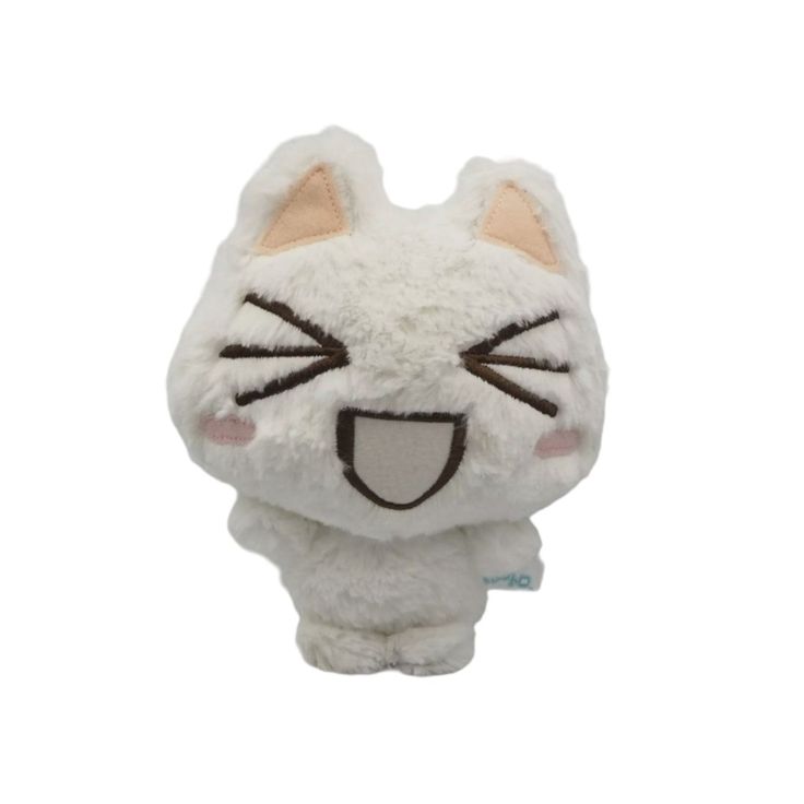 a small white cat stuffed animal with eyes closed and ears wide open, sitting on a white surface