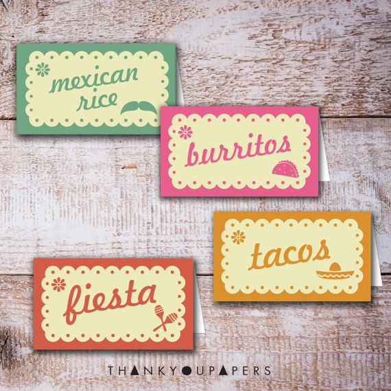 four mexican food labels are shown on a wooden surface, with the words fiesta written in different colors