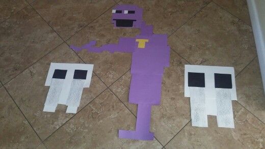 some paper cut out to look like the characters from minecraft