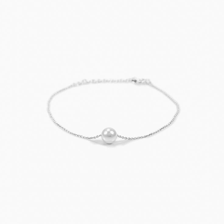 Are you a minimalist who loves dainty and simplistic designs? Then we have a bracelet that is just the right one for you. The Abby Single Pearl Bracelet is just what its name implies. The design features a big shiny pearl as the centerpiece. This single adornment is all the bracelet needs to deliver a powerful and highly elegant impact for you. - Rhodium and Gold plating over Sterling Silver- 1 Swarovski pearl, 6mm in diameter- Adjustable length of 5.5" to 6.5"- Available in Yellow Gold, White G Cocktail Bracelet, Cultured Pearl Bracelet, Single Pearl, Cultured Pearl Necklace, Bow Jewelry, A Bracelet, Swarovski Pearls, Silver Pearls, Cultured Pearls