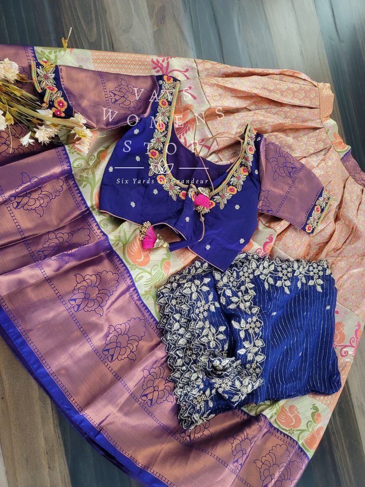 This Traditional Half Saree Set is a must-have for any woman looking to add a touch of elegance and tradition to her wardrobe. Made from premium quality Kanchi material, this saree set is not only beautiful but also durable and comfortable to wear. The set includes a blouse that is stitched and comes in a size 34, with inner margins that can be expanded up to size 40. For those who need a size 32, alterations can be done upon request. The lehenga is also expandable and has inner margins to incre Silk Designer Sets For Navratri, Silk Sets For Designer Wear Navratri, Silk Sets For Designer Wear During Navratri, Elegant Chanderi Sets With Unstitched Blouse, Bollywood Art Silk Sets For Designer Wear, Zari Work Silk Saree Set, Chanderi Cutdana Saree Set, Traditional Drape Dola Silk Set, Silk Saree Sets With Zari Work