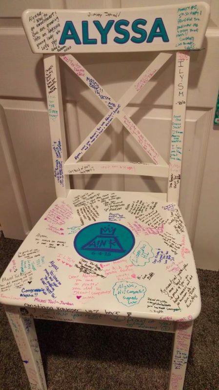 a white chair with writing on it and the name alyssa written all over it