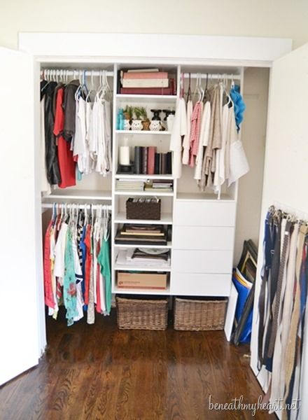 an organized closet with clothes and other items