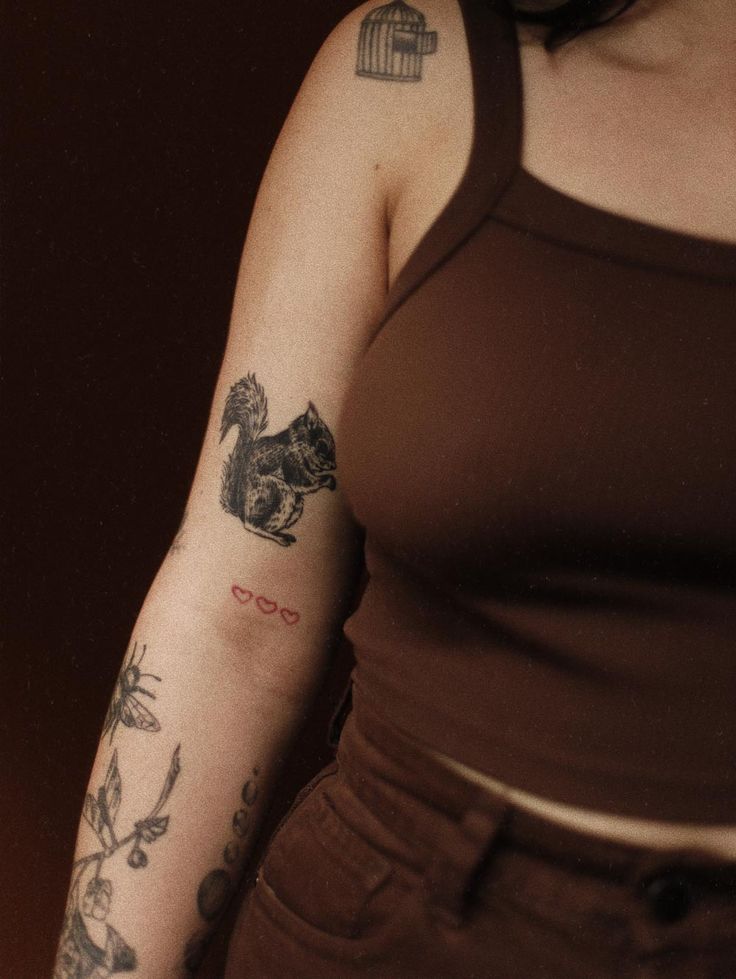 a woman with a tattoo on her arm