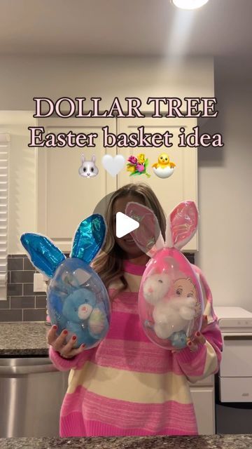 a girl holding two plastic easter baskets in her hands