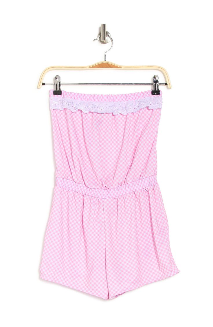 A strapless romper features an allover print and lace trim for feminine flair. 24" full length, 2.5" inseam (size S) Strapless Pull-on style Allover print Lace trim Elasticized waist 90% nylon, 10% spandex Machine wash cold Imported Model stats: 5'10", Bust: 32", Waist: 25", Hip: 36". Model is wearing size S. Sleeveless Lace Trim Jumpsuit, Summer Strapless Jumpsuit With Elastic Waistband For Loungewear, Spring Strapless Jumpsuit For Loungewear, Strapless Jumpsuits And Rompers For Summer Loungewear, Spring Strapless Jumpsuit With Elastic Waistband For Loungewear, Strapless Cotton Jumpsuits And Rompers For Spring, Summer Beach Jumpsuits And Rompers With Lace Trim, Lace Pants, Strapless Romper