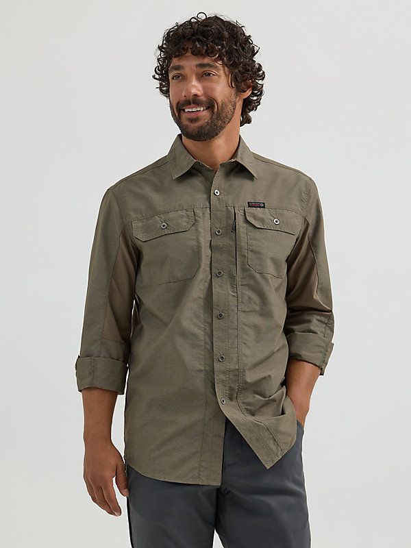 MIXED MATERIAL FOR OUTDOOR COMFORT ATG by Wrangler™ is a collection of everyday outdoor styles that will keep you dry and comfortable in all conditions. This mix material shirt has it all: style, functionality, and protection. Its mixed material design incorporates contrasting, breathable knit panels at the sides and sleeves for optimum comfort and mobility. This shirt features a regular fit with convertible roll-up back capping on the sleeves, moisture-wicking properties, and UPF 30 protection Khaki Cotton Camp Shirt For Outdoor, Outdoor Khaki Cotton Camp Shirt, Rugged Outdoor Shirt With Relaxed Fit, Rugged Long Sleeve Shirt For Outdoor, Rugged Relaxed Fit Shirt For Outdoor, Khaki Relaxed Fit Shirt For Outdoor, Outdoor Khaki Relaxed Fit Shirt, Rugged Cotton Outdoor Shirt, Casual Durable Shirt For Outdoor