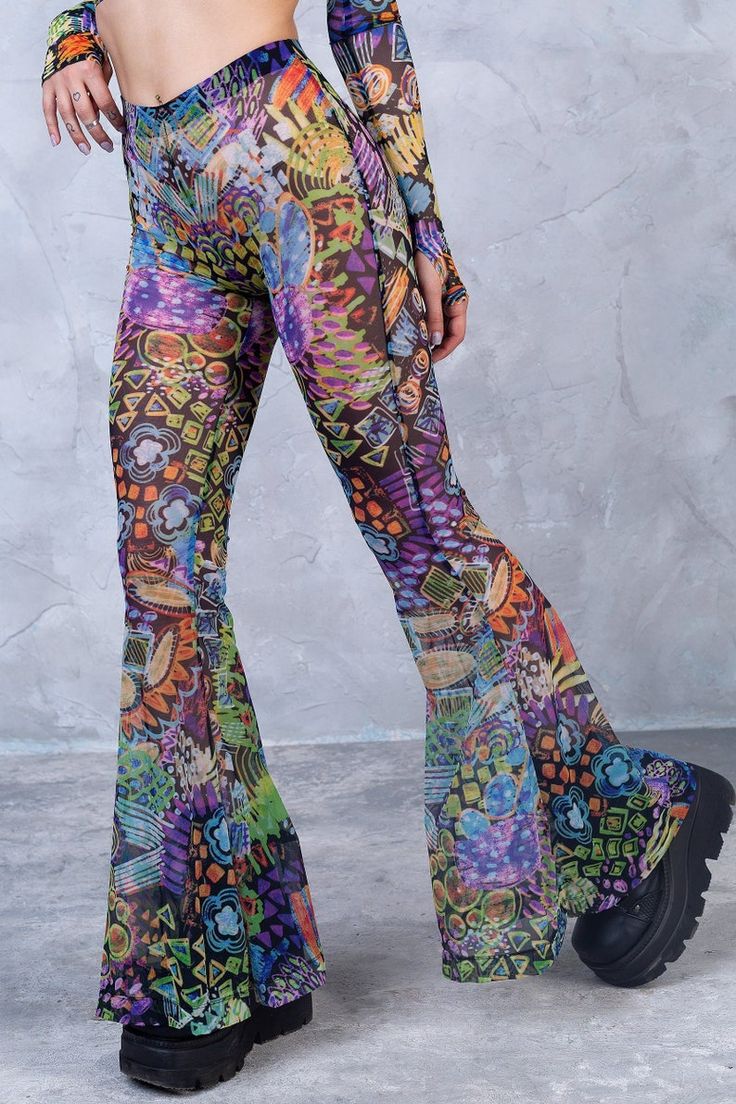 Hippie Stretch Bottoms For Festival, Stretch Hippie Pants For Festivals, Sheer Stretch Pants For Spring, Bohemian Bottoms For Music Festival, Bohemian Style Bottoms For Music Festival, Trendy Sheer Bottoms For Spring, Groovy Summer Festival Bottoms, Trendy Multicolor Festival Pants, Hippie Bottoms For Spring Music Festival