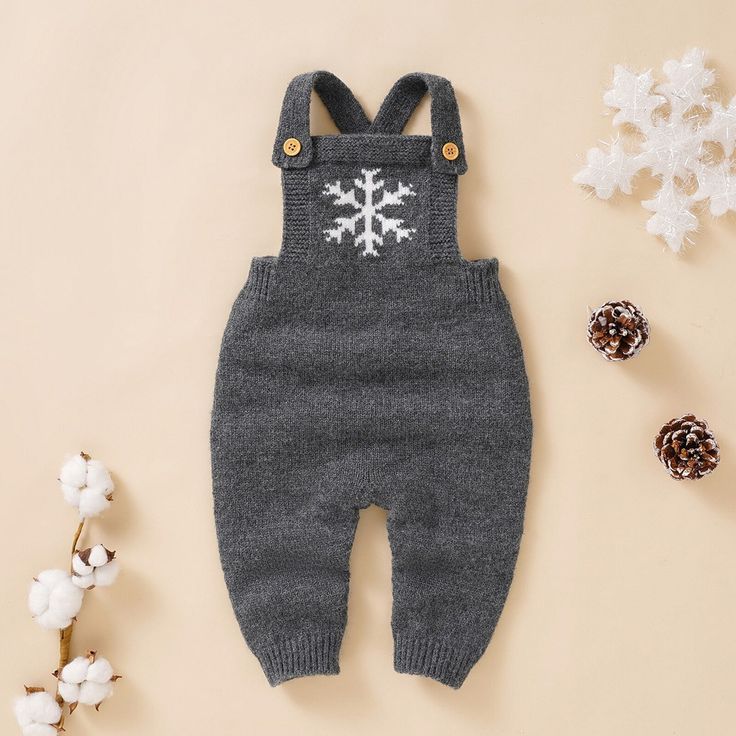 These adorable knit jumpsuits area great combination of warm, cozy and cute all packed in one. Comes in 3 colors. Lay flat to dry Imported CLEARANCE ITEM - LAST FEW IN STOCK! Cotton Long Sleeve Overalls For Winter, Cozy Solid Onesie For Winter, Cozy Solid Color Onesie For Winter, Winter Knitted Long Sleeve Onesie, Winter Cotton Onesie, Winter Solid Jumpsuits And Rompers For Loungewear, Cozy Winter Loungewear Jumpsuits And Rompers, Winter Cotton Jumpsuits And Rompers For Loungewear, Gray Long Sleeve Jumpsuits And Rompers For Winter