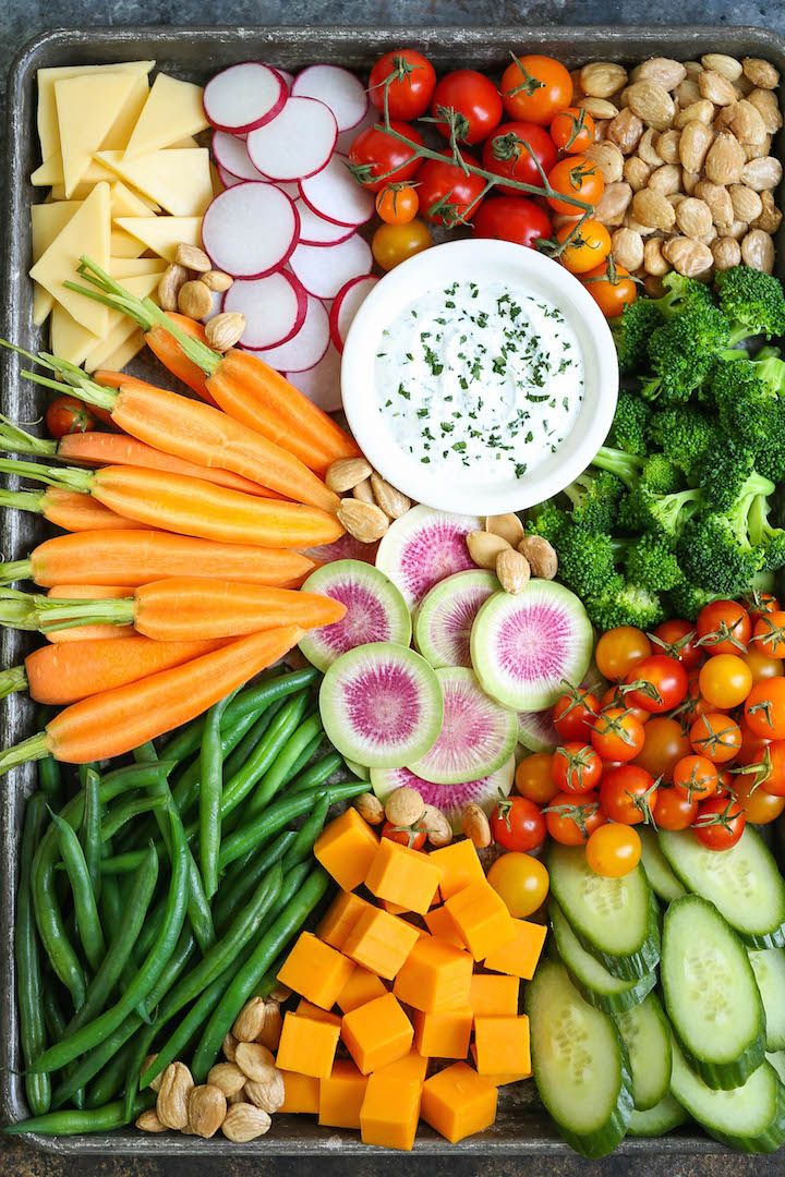 a tray filled with lots of different types of vegetables