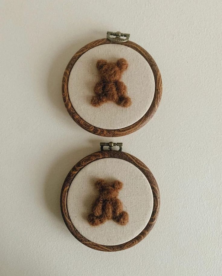 two brown teddy bears are in the hoop