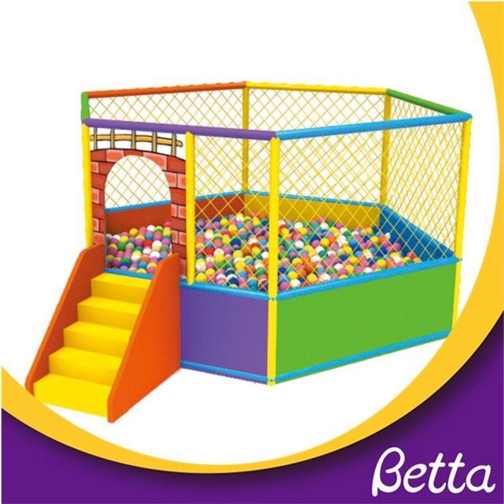 an indoor play area with colorful balls in it and stairs leading up to the top