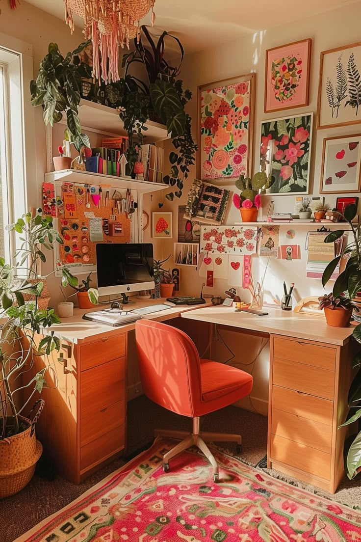 a home office with lots of plants and pictures on the wall behind the computer desk