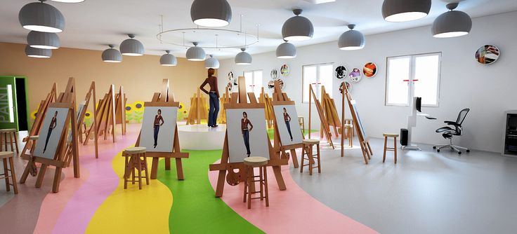 an artist's studio with multiple easels and paintings on the floor in different colors