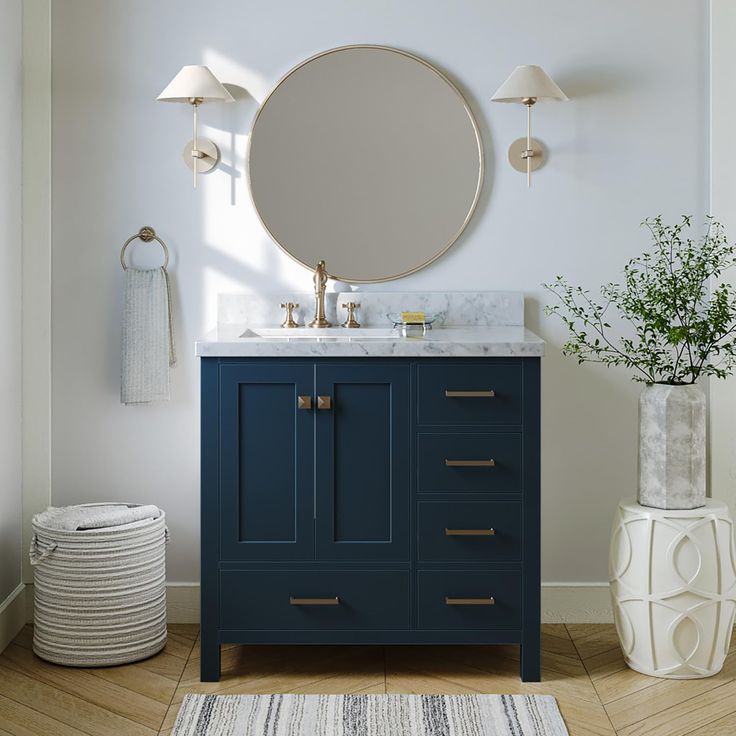 a bathroom vanity with a round mirror above it and a rug on the floor next to it