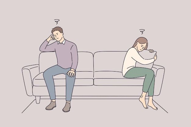 a man and woman sitting on a couch with their backs turned to the opposite direction