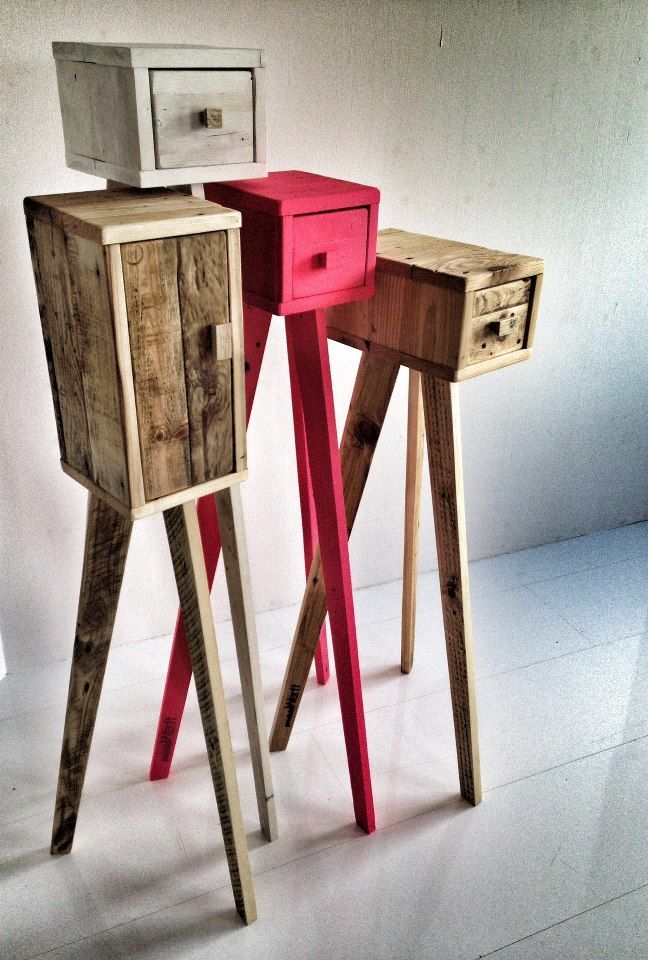 two wooden side tables with drawers on each one and a microwave on top of them