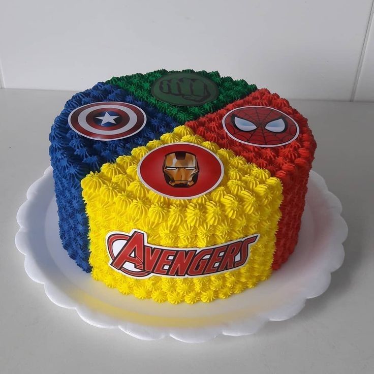 the cake is decorated with avengers symbols on it