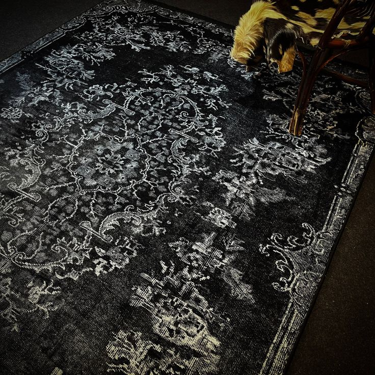 a black rug with white designs on it