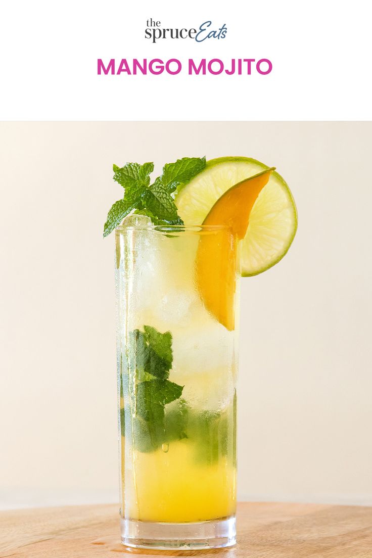 a tall glass filled with lemonade and lime