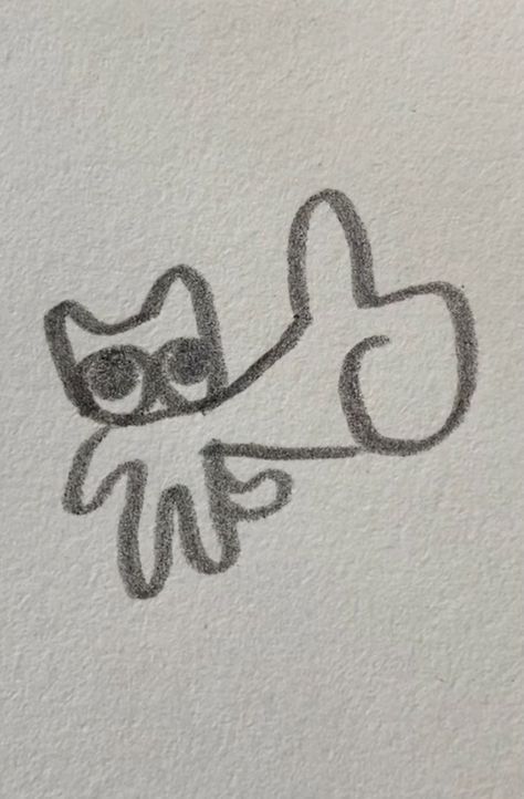 a drawing of a cat with glasses on it's head and the word love written in black ink