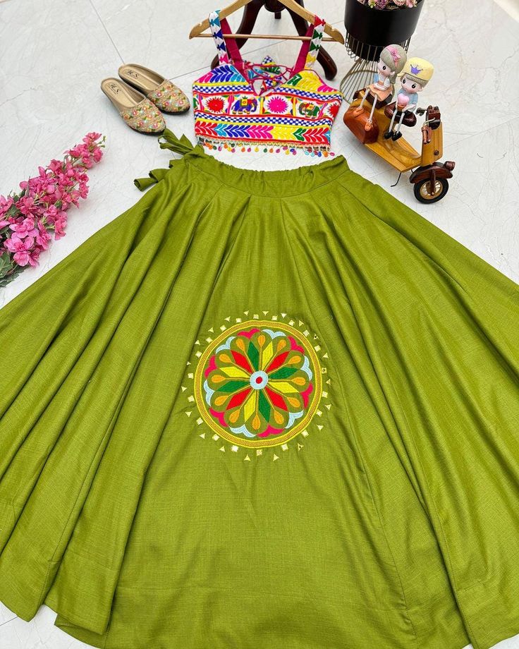 Designer Party Lehenga Choli Fully Stitched 👚BLOUSE🎉 🧶Febric: Cotton Silk 🪢Work: Embroidery work 👗Size: 38 Size but there is extra margin so can adjust upto 36" to 44" 📏Length: 16 📌Sleeves: Sleeve less 💃LEHENGA🎊 🧶Febric: Cotton Silk 🪢Work: Real Mirror and Embroidery work 👗Size: Supported upto 44" 📏Length: 42 Flair: 6 Mtr 📌Latkan: Yes Green Floral Embroidered Choli For Party, Pista Green Choli With Floral Embroidery For Party, Green Cotton Sets With Zari Work, Green Traditional Wear With Handwork For Party, Green Embroidered Choli For Navratri, Green Cotton Sets With Floral Embroidery, Embroidered Green Choli For Festivals, Embroidered Green Choli For Navratri, Festival Green Choli With Floral Embroidery