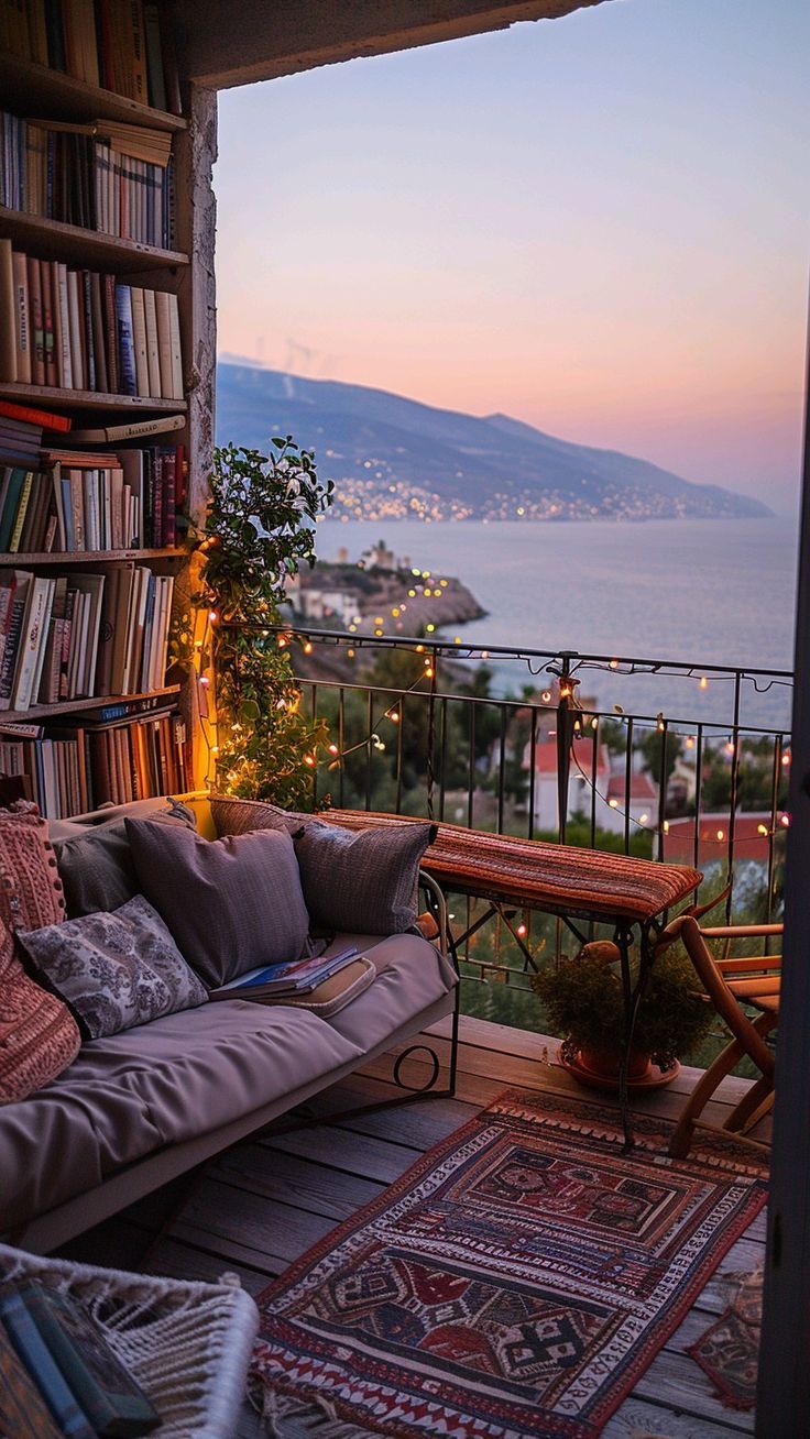 a couch sitting on top of a wooden floor next to a book shelf filled with books