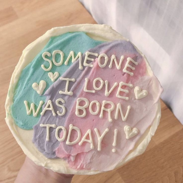 someone is holding up a cake that says someone i love't was born today