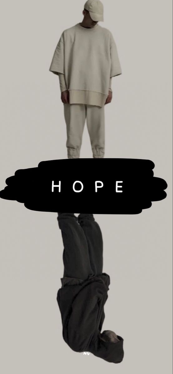 a man standing in front of a mirror with the words hope on it's side