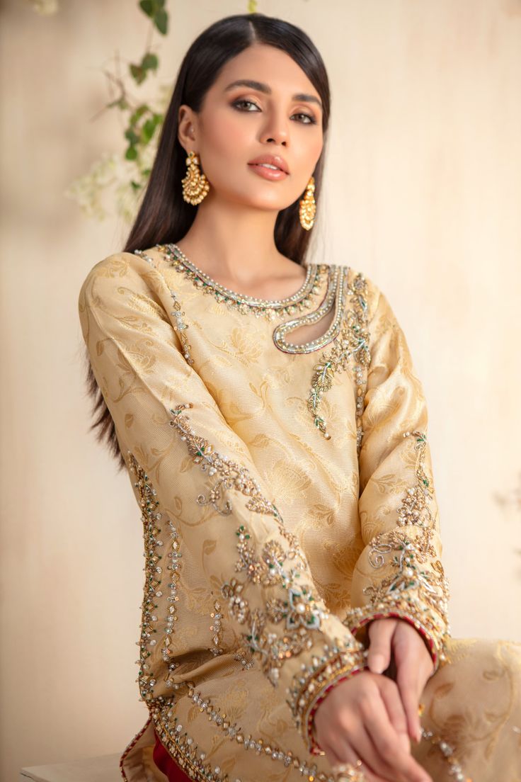 A contemporary Classic - Over a canvas of pure jacquard silk net, features a beautiful floral embroidery further enhanced with dabka, sequins, pearls, gota & bead work. This classy column shirt is paired with gorgeous pure jamawar shawl featuring stunning paisley & floral embroidery, making this an absolute favorite for all celebratory festivities. Hand crafted tassels & gota embellished Pure Raw Silk Izaar completes the look of this outfit. Shirt Fabric: Pure Jacquard Silk Net Shirt Length: 48” Shirts With Embroidery, Embroidery With Sequins, Organza Styles, Gold Shawl, Net Shirt, Designer Outfit, Makeup Idea, Kurta Neck Design, Pasta Salads