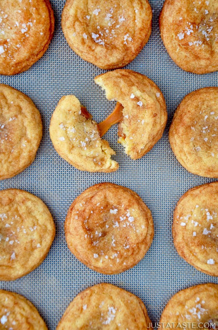 baked cookies with powdered sugar are on a baking sheet, ready to be eaten