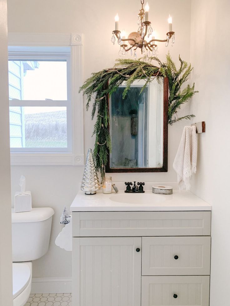 a bathroom with a sink, mirror and toilet