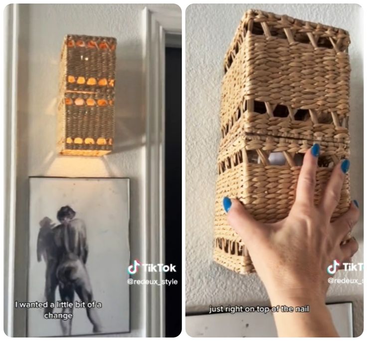 a person holding a basket in front of a wall with pictures on it and an image hanging from the wall