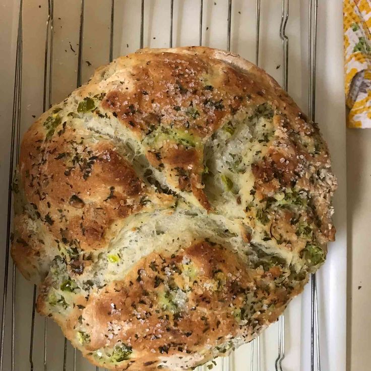 a loaf of bread sitting on top of a cooling rack