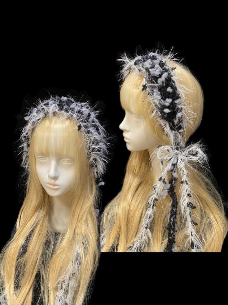 two mannequins with long blonde hair wearing headdress