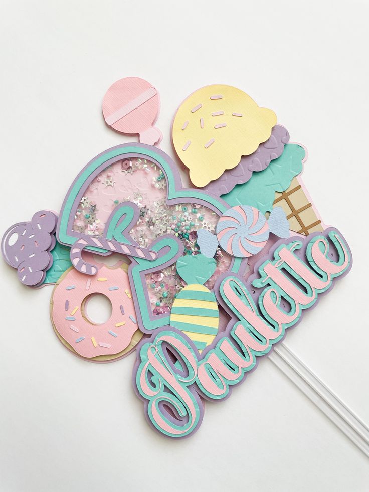 a cake topper that says i love ice cream, donuts and other treats