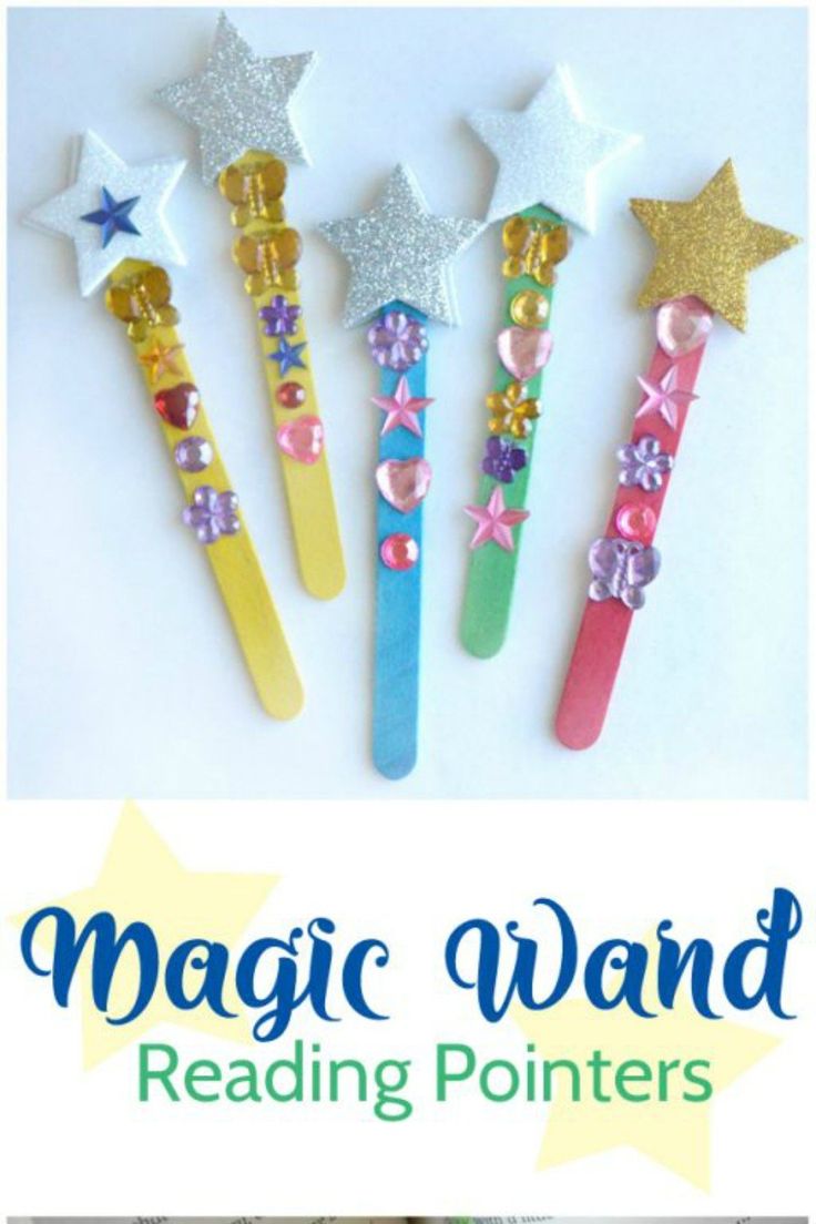 three toothbrushes decorated with glitter stars and bowknots are lined up on a white surface