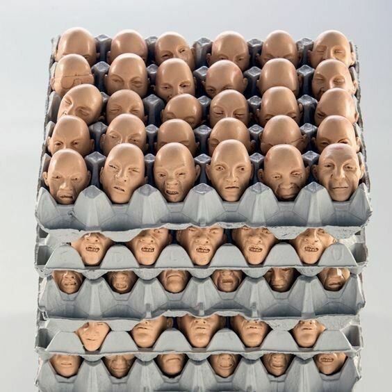 there are many heads stacked on top of each other in the shape of people's heads