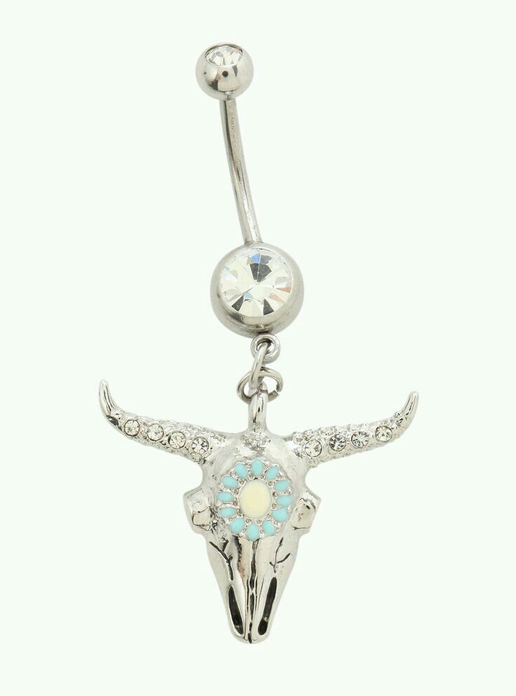 a silver colored belly ring with an animal's skull on it