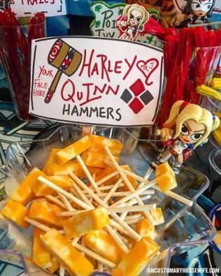 there are many different types of food on the table and one has a sign that says harley's quin hammers