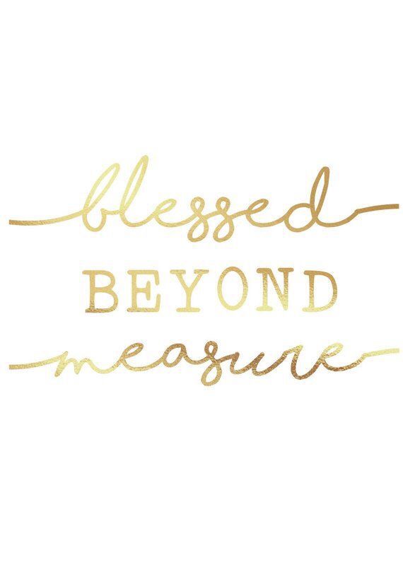 gold foil lettering that says, blessed beyond measure on a white background with the words below it