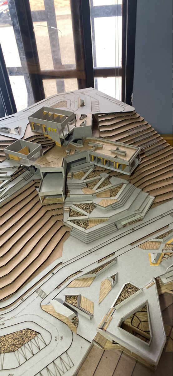 an architectural model of a building with multiple levels and sections that are connected to each other