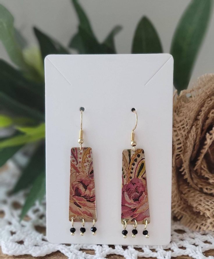 These raw brass earrings sound absolutely enchanting! The floral design gives them that perfect boho vibe, and the solid brass back adds a lovely contrast. The matching set of beads is such a charming detail, making them truly unique. Using repurposed materials with a decoupage technique adds an artistic touch that makes each pair special. They're not just accessories; they're little works of art! Fall Roses, Decoupage Jewelry, Roses Gift, Earrings Fall, Rose Gift, Boho Vibe, Brass Earrings, Boho Floral, Works Of Art