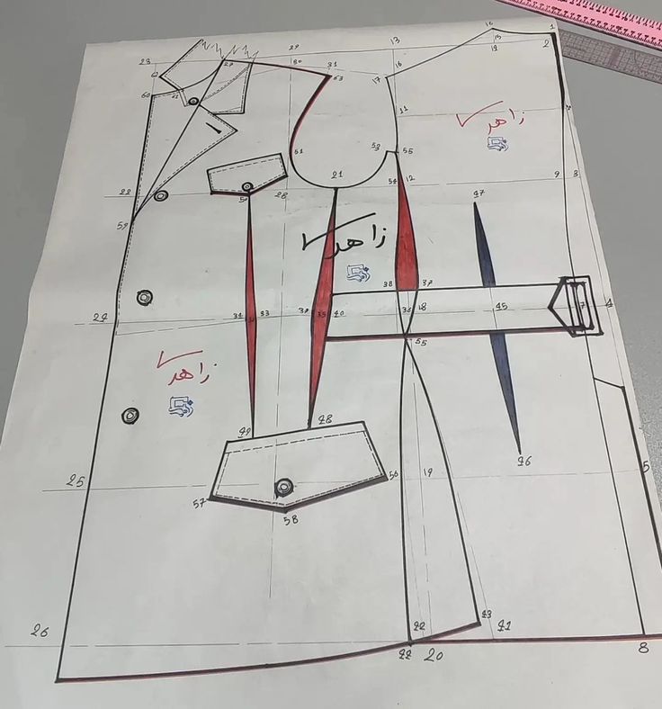 a drawing of a shirt and tie on top of a piece of paper next to scissors