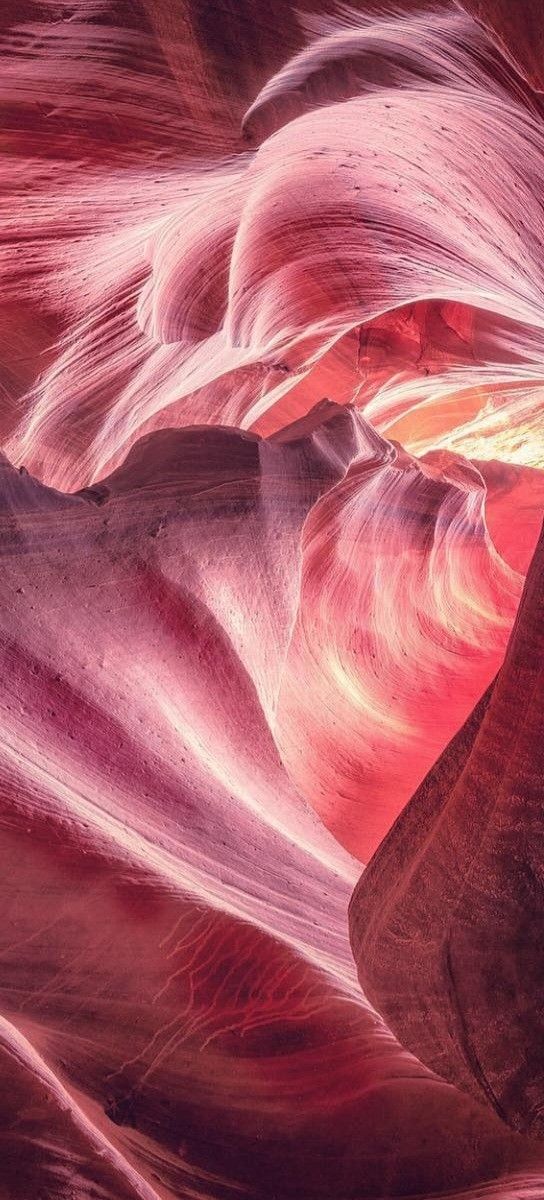 an image of the inside of a canyon that looks like it has been painted red and pink