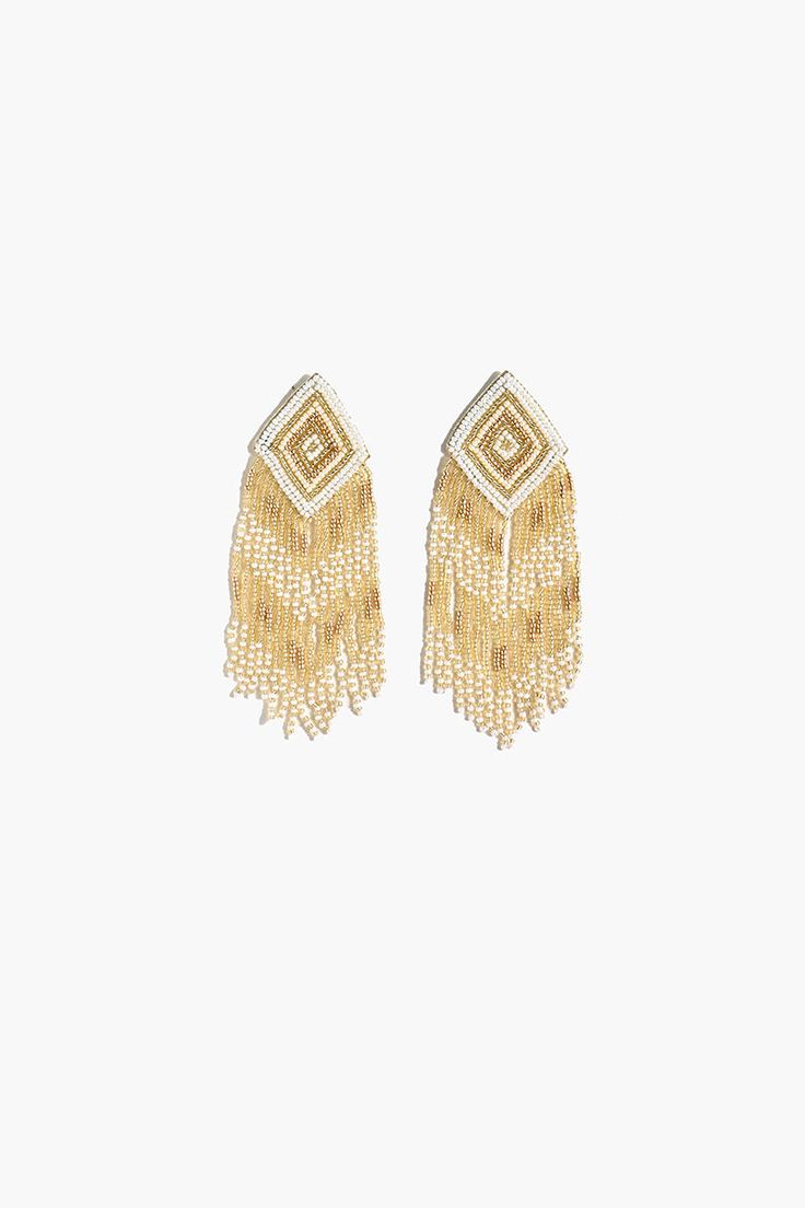 The beautiful Angelina Earrings are a stunning addition to any outfit. Hand beaded with shades of gold and white, they are a striking accessory that will add a touch of glamour to any ensemble. The earrings are hand crafted by skilled artisans. The intricate bead fringe detail on the earrings add a touch of elegance to the overall design and are sure to add a touch of sophistication to any outfit. Whether you’re dressing up for a special occasion or simply looking to add a little sparkle to your Elegant Tassel Earrings For Festive Occasions, Elegant Summer Chandelier Earrings With Tassels, Elegant Summer Tassel Chandelier Earrings, Gold Beaded Earrings With Dangling Beads For Evening, Elegant Gold Beaded Earrings For Summer, Gold Dangling Beads Earrings For Evening, Elegant Dangle Beaded Earrings For Summer, Gold Earrings With Dangling Beads For Evening, Elegant Summer Chandelier Earrings With Dangling Beads