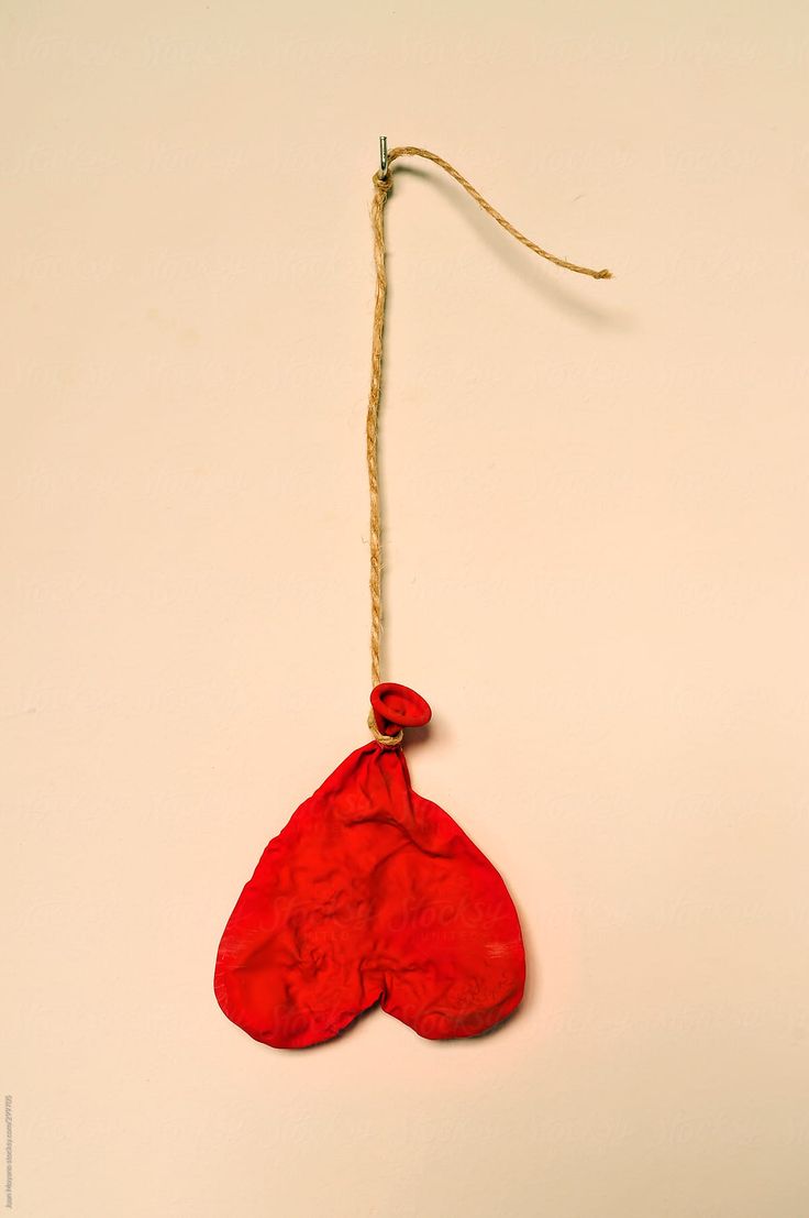 a red boxing glove hanging from a string