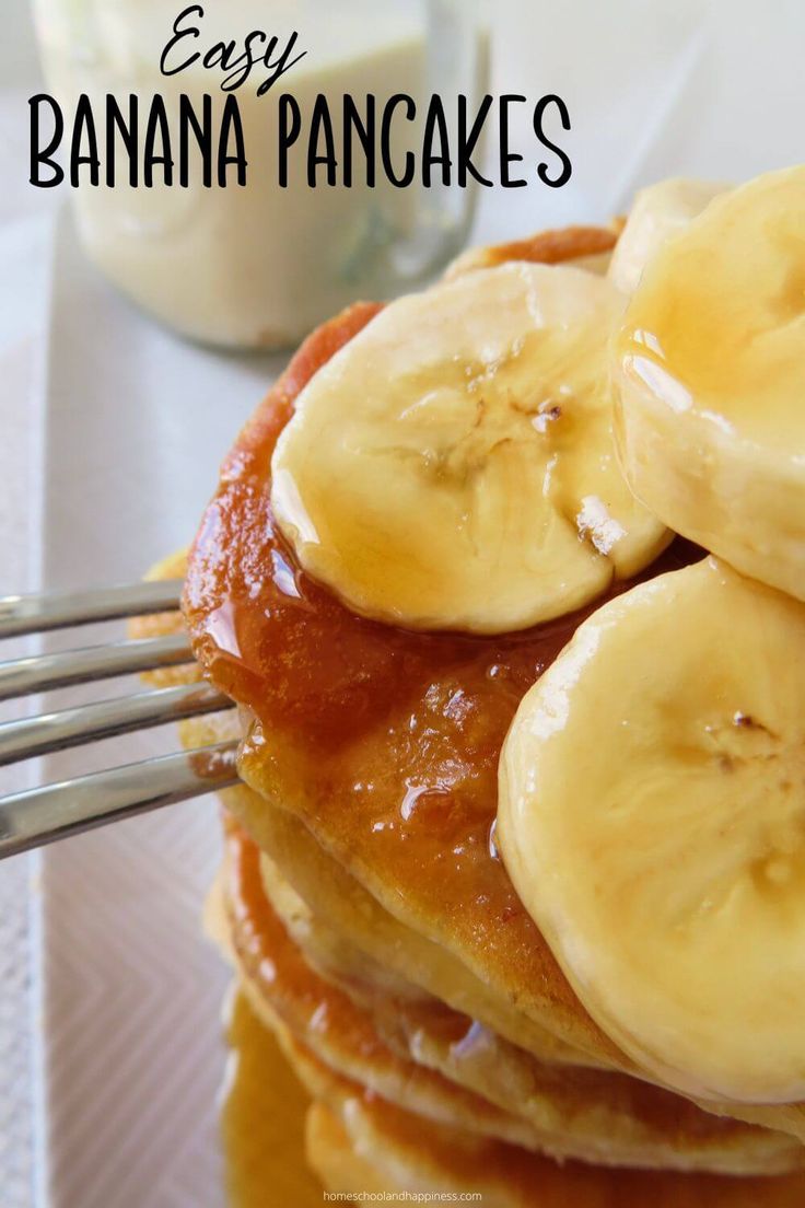 a stack of pancakes with bananas on top